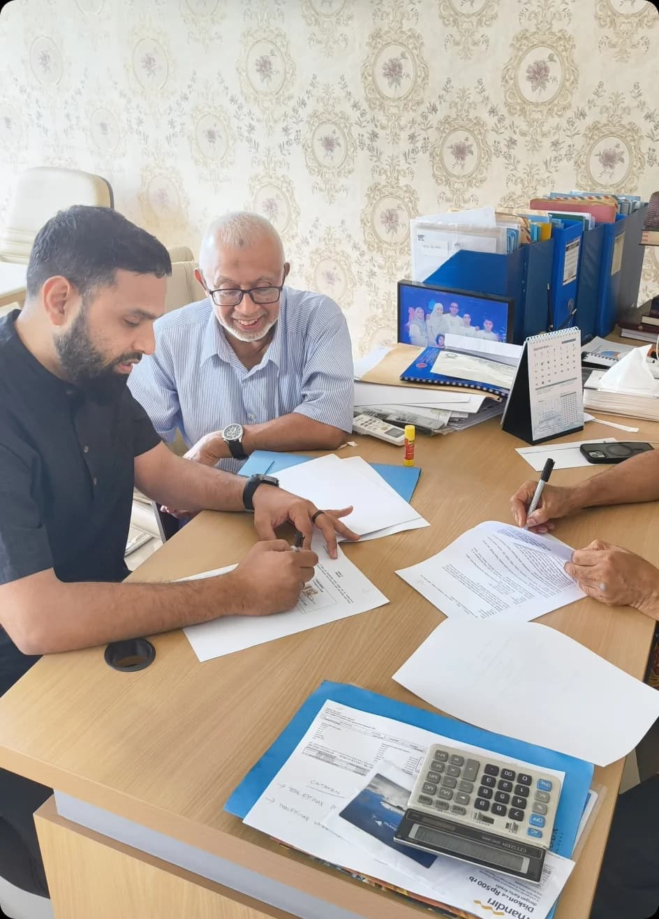 Founders reviewing deal documents across a desk
